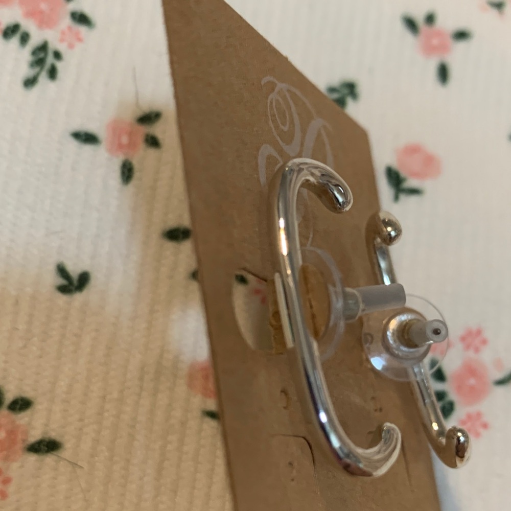Plunder Shiny Silver Tone Curved Earrings - Picture 2 of 2